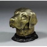 An Elizabeth II silver gilt dog head pattern table lighter, 3ins high, by Tiffany & Co, London 1960,