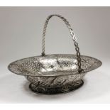 An early George III silver oval cake basket with rope pattern rim, the sides pierced with leaf