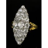 A late Victorian 18ct gold all diamond set marquise pattern ring, the face set with twenty-one old