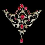 A late Victorian gold and silvery coloured metal mounted ruby and diamond set brooch, the