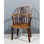 A 19th Century child's yewwood, ash and elm seated two tier stick back Windsor armchair on turned