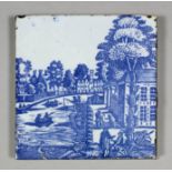 An 18th Century English Sadler & Green Delft tile with blue wood block printed design of a canal