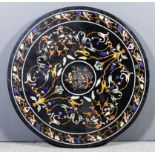 A 19th Century Italian Pietra Dura circular table top decorated with birds perched on branches,