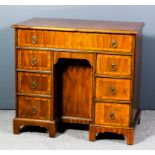 A modern lady's figured walnut kneehole dressing table by Maitland Smith in the 18th Century manner,