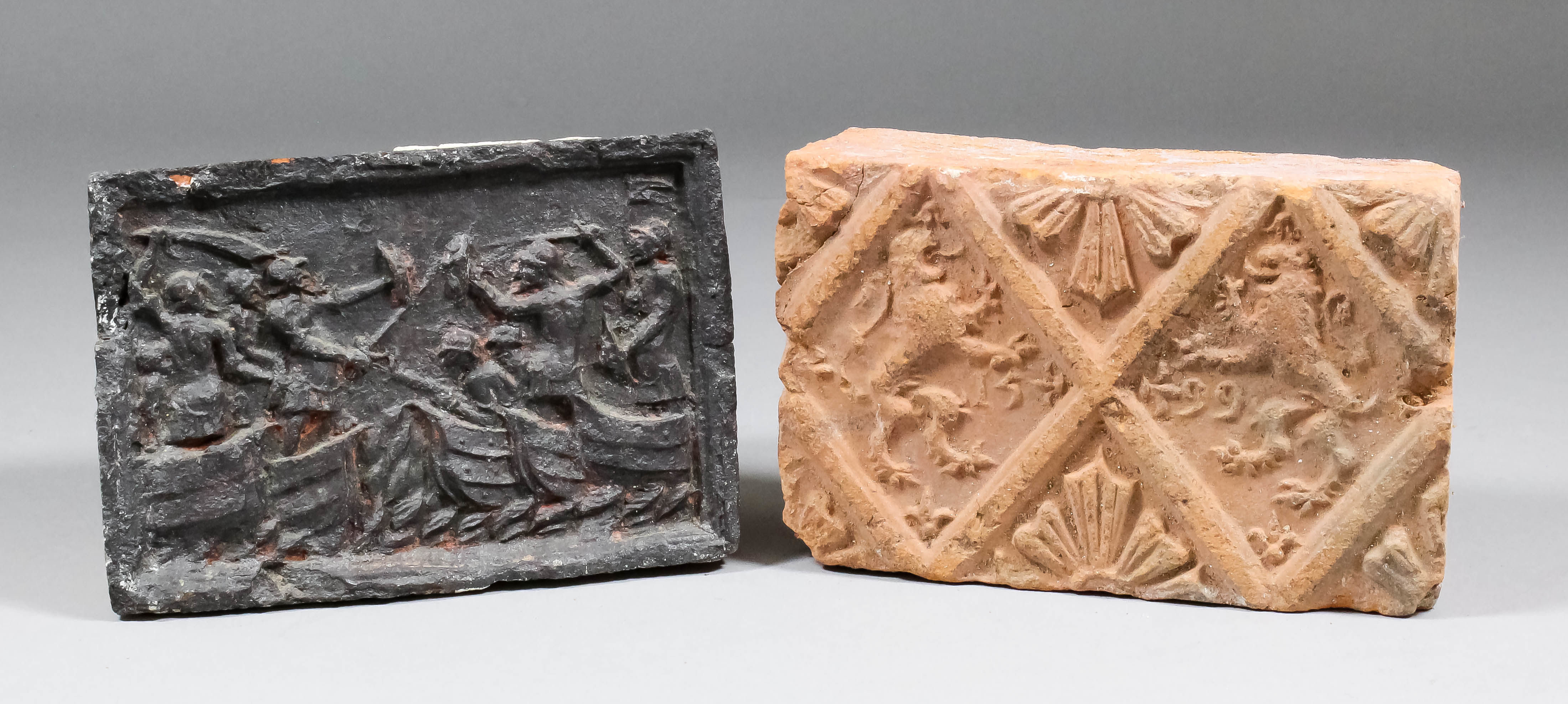 A late16th Century fire brick, the moulded design of two rampant facing lions within a diamond