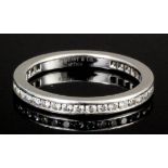 A modern Tiffany platinum and all diamond set full hoop eternity ring, the face channel set with