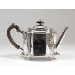 A George III silver teapot, the oval body with incurved panels and angular spout engraved with