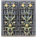 A pair of cast iron rectangular grilles, cast with long stemmed flowers, 31.5ins x 13.75ins