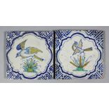 Two early 17th Century Dutch Delft maiolica tiles decorated in colours and blue with birds within