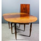 A 19th Century French fruitwood oval extending drop-leaf dining table with two extra leaves, twin