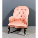 A Victorian walnut spoon back nursing chair, upholstered in rose damask, the back buttoned, on