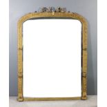 A Victorian gilt framed overmantel mirror with leaf and scroll cresting, the moulded frame with