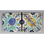 Two early 17th Century Dutch maiolica tiles, one with pomegranate and one with grapes, with fleur-