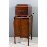 An HMV mahogany cased gramophone with pagoda top, cupboard to front enclosed by a pair of doors,