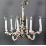 A Sitzendorf porcelain nine light chandelier (now fitted with electric candle fitments) with