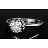 A modern platinum mounted diamond solitaire ring, the brilliant cut stone approximately .90ct (gross