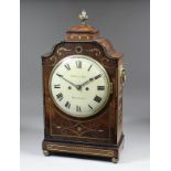 An early 19th Century brass inlaid mahogany mantel clock by Smith & Son of Reading, the 8ins