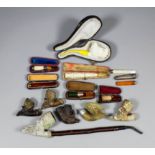 A collection of clay, Meerschaum and wood pipes, and a small collection of cheroot holders,