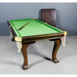 An early 20th Century mahogany billiards table / dining table by E.J.Riley No. A 68563 with four