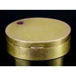 An early 20th Century Continental gold coloured metal oval pattern snuff box inset with a heart