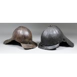 A 17th Century "Lobster Tail" helmet, 8.5ins high, and another similar, 7.75ins high (Low