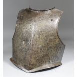 A 16th/17th Century breast plate armour, 12.75ins high (Low Countries)