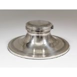 A large George V silver capstan pattern inkwell with reeded ornament, bands of engine turned