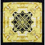 A Hermes black and gold "Eperon d'Or" silk scarf, 35ins square, with box