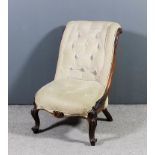 A Victorian rosewood framed scroll back nursing chair upholstered in cream striped velour, the