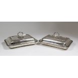 A pair of George V silver rectangular entree dishes and covers with gadroon mounts to rim, 11.