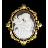 A late Victorian gold coloured metal mounted oval cameo brooch in swivel mount, the cameo carved