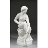 A 19th Century English Parian figure of a seated nude female, 16.5ins high (unmarked - slight