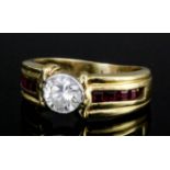 A modern 14ct gold ruby and diamond ring, the central brilliant cut diamond approximately .75ct in