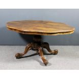 A Victorian rosewood oval breakfast table of shaped outline with moulded edge to top, on bulbous