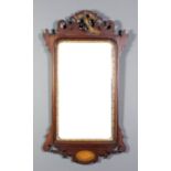 A mahogany framed and parcel gilt rectangular wall mirror of 18th Century design, the fretted,