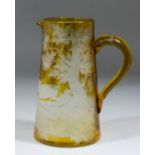 A 19th Century Bohemian amber glass water jug, engraved with stag and doe in a landscape, 10.5ins