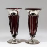 A pair of George V silver vases with plain flared rims and wirework bodies and plain moulded