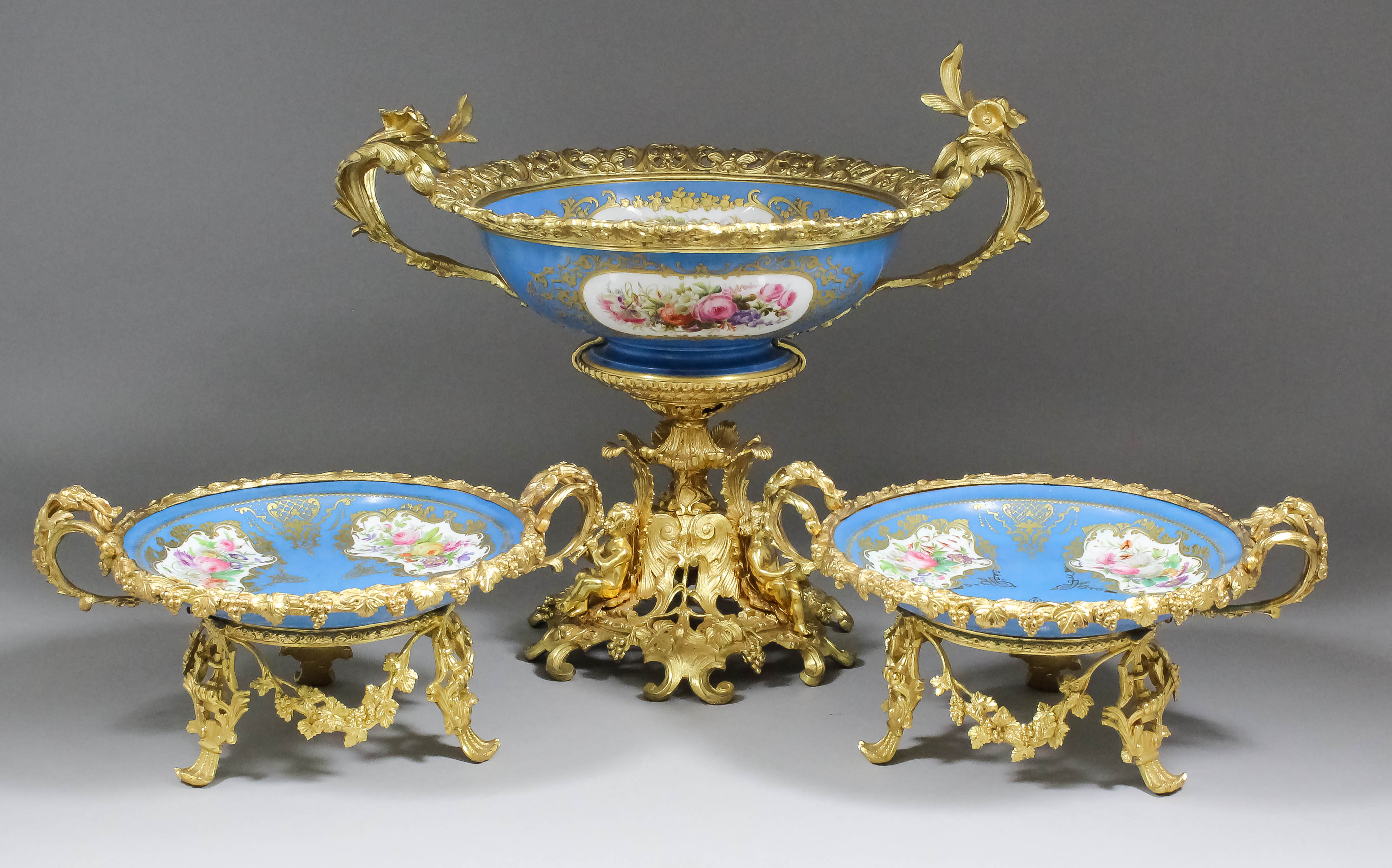 A mid 19th Century Sevres porcelain and gilt metal mounted two-handled tazza painted with flowers in