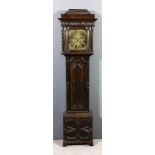 An old oak longcase clock, the 11ins square brass dial inscribed "Stringer of Stockport", the