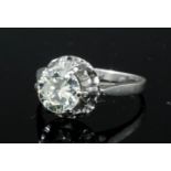 A modern 18ct gold mounted diamond solitaire ring, the brilliant cut stone approximately 1ct above