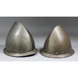 A late 16th/early 17th Century "Pear Stalk" cabasset helmet, 7.5ins high, and another similar, 8.