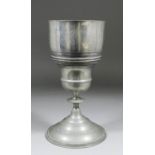 An 18th Century pewter chalice with two narrow bands of anthemion decoration to the upper body, with