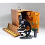 A 1950s Cooke, Troughton & Simms polarising petrographic microscope, Serial M702945, with spare