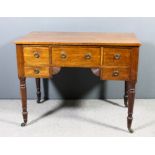 A mahogany rectangular side table of Georgian design with square edge to top, fitted five drawers on