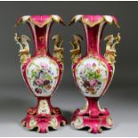 A pair of 19th Century Continental urn shaped two-handled vases on low rococo stands and mythical