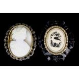 A late 19th Century gold coloured metal and cut Berlin steel mounted Italian oval cameo brooch,