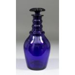 A late 18th Century English blue glass "Prussian" three ring decanter with mushroom stopper, 10ins