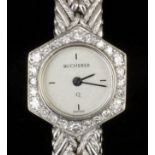 A lady's 18K white gold cased cocktail watch, the silver face quarter set with baton numerals within