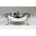 An Edward VII silver circular fruit bowl or centrepiece, the shallow bowl with shaped and moulded