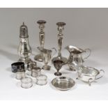 A pair of George V silver pillar candlesticks with hexagonal columns and circular bases, 7.75ins